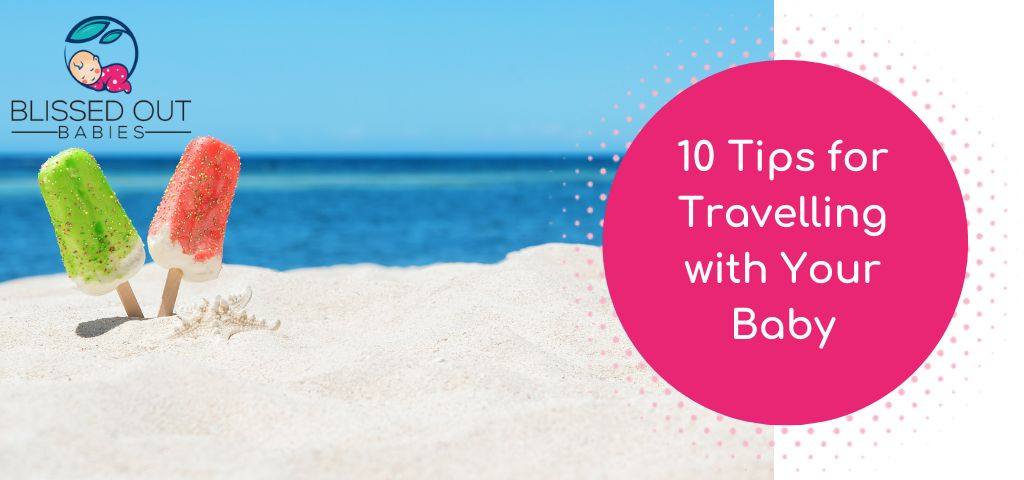 10 Tips for travelling with your baby. Picture of 2 ice lollies stuck in the sand on a sunny beach.