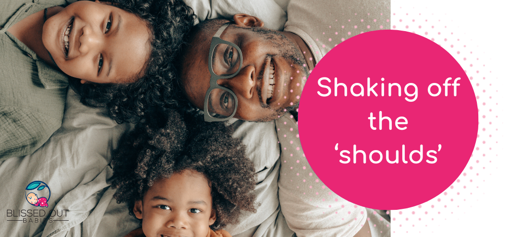 Image of a father and two children lying on a bed smiling up at the camera. Pink circle with the words: Shake off the parenting 'shoulds'