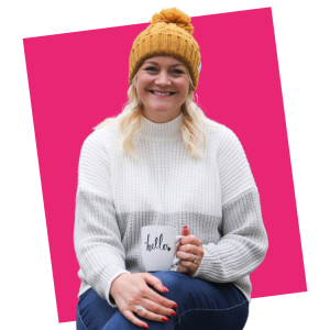 Image of Jemma Munford wearing yellow hat and holding a mug that says 'hello' on it